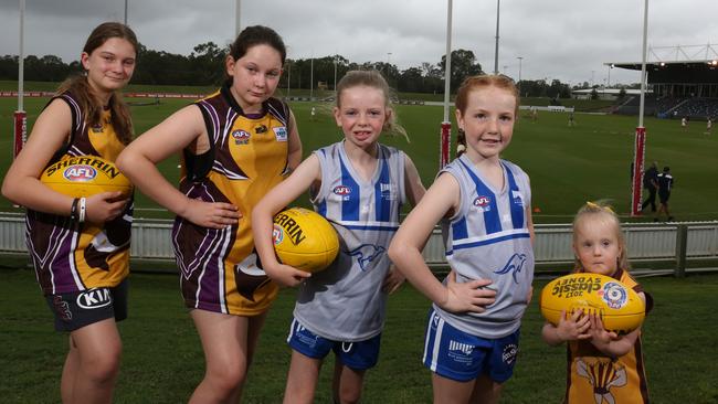 Mackenzie Lillia, Piper Lillia, Millie Spencer, Abby Croucher and Aubrey Chobdzynski, 4, are part of a new wave of girls interested in AFL.