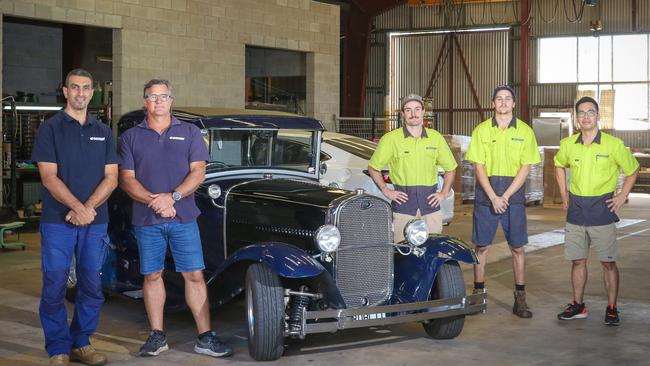 The Carcom team Hafez Ajjur, Tony Copley, Mitchell Copley, Brady Rothwell and Vinh Vu resume trading in new premises after devastating fire. Picture: Glenn Campbell