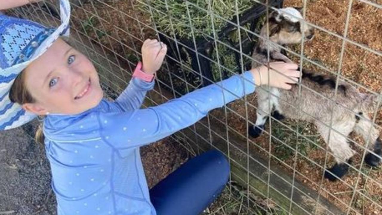 Lilli Jones, 8, and her mother Krystina are on the hunt for a silver bangle with floated away with a helium balloon at the Toowoomba Show.