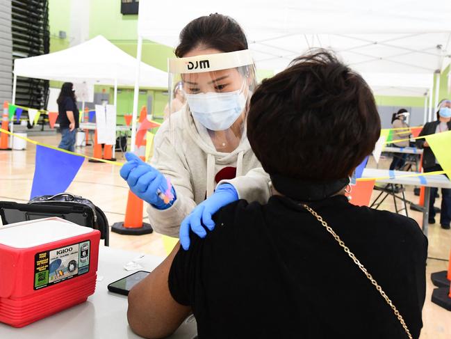 Carolyn Fowler of the Los Angeles Unified School District receives her Covid-19 vaccination. Covid jabs are now compulsory for all students in California. Picture: AFP