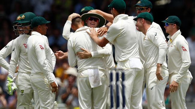 Aussie players celebrate Peter Handscomb’s amazing catch. Picture: Getty Images