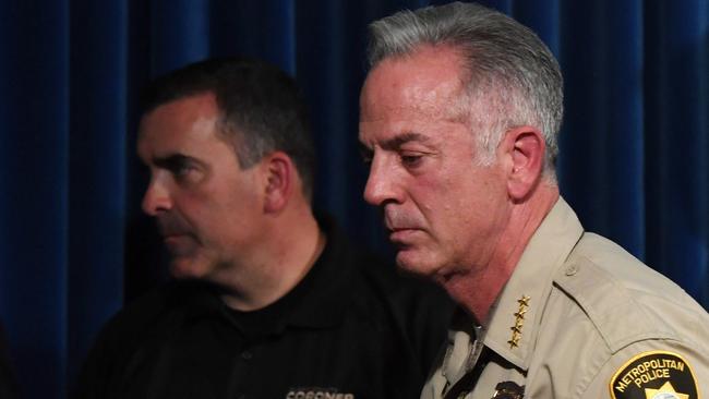 Clark County Coroner John Fudenberg and Clark County Sheriff Joe Lombardo leave a news conference at the Las Vegas Metropolitan Police Department headquarters.