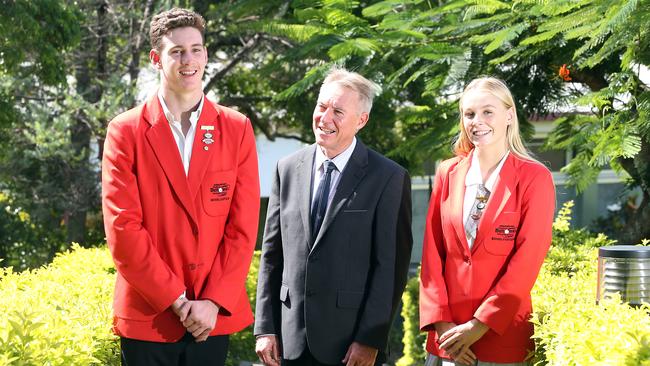 Benowa State High School principal Mark Rickard with school captains Matthew Coombes and Jemma Davey. Picture: AAP Image/Richard Gosling