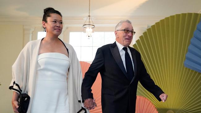 Robert De Niro and girlfriend Tiffany Chen arrive. Picture: AFP