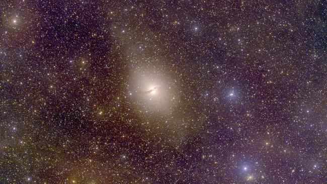 Scientists have discovered that dwarf galaxies orbiting Centaurus A, about 13 million light years away, are mostly travelling in the same direction and within a single plane. Picture: ANU SkyMapper.