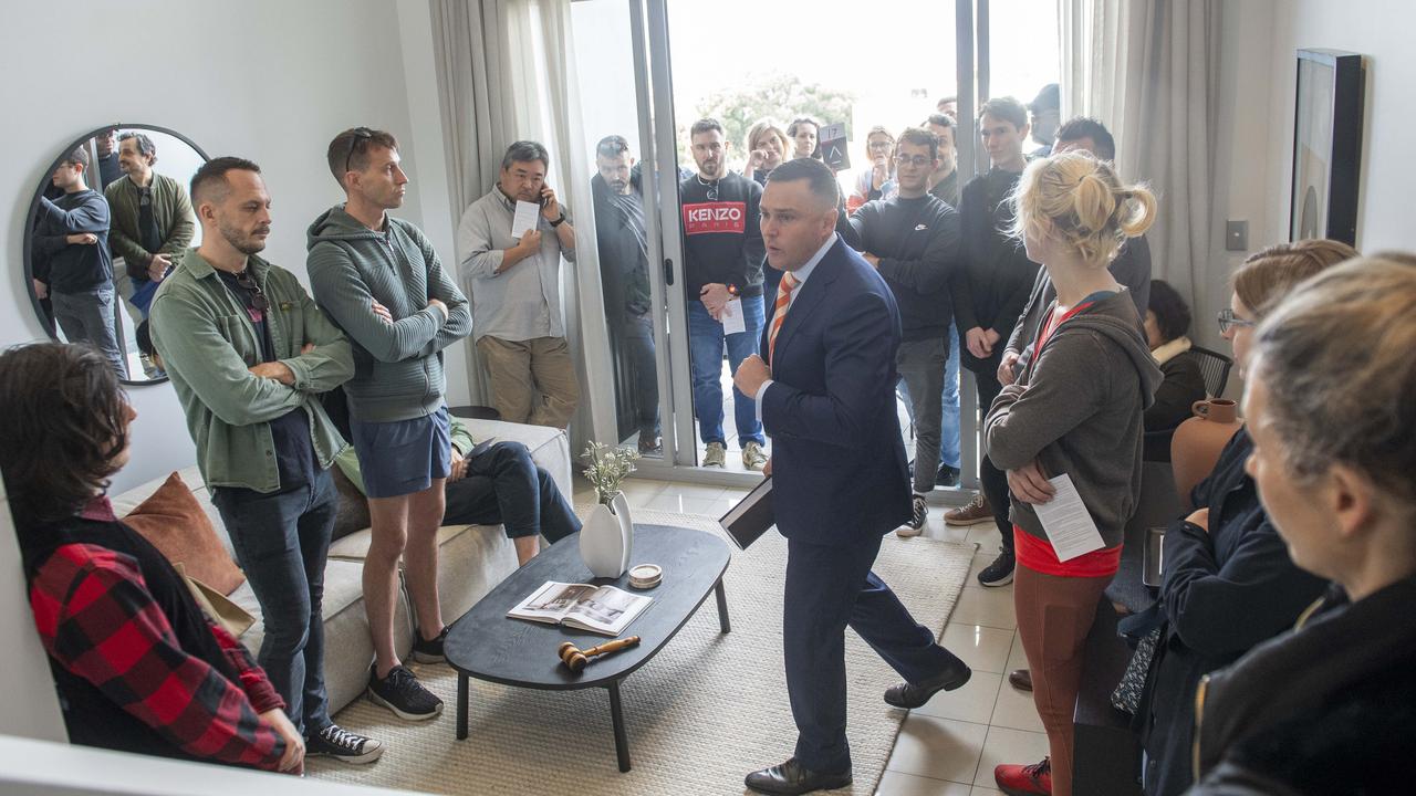 First home buyers cram into 51/32 Rosehill St, Redfern at today’s auction. Photo by Jeremy Piper