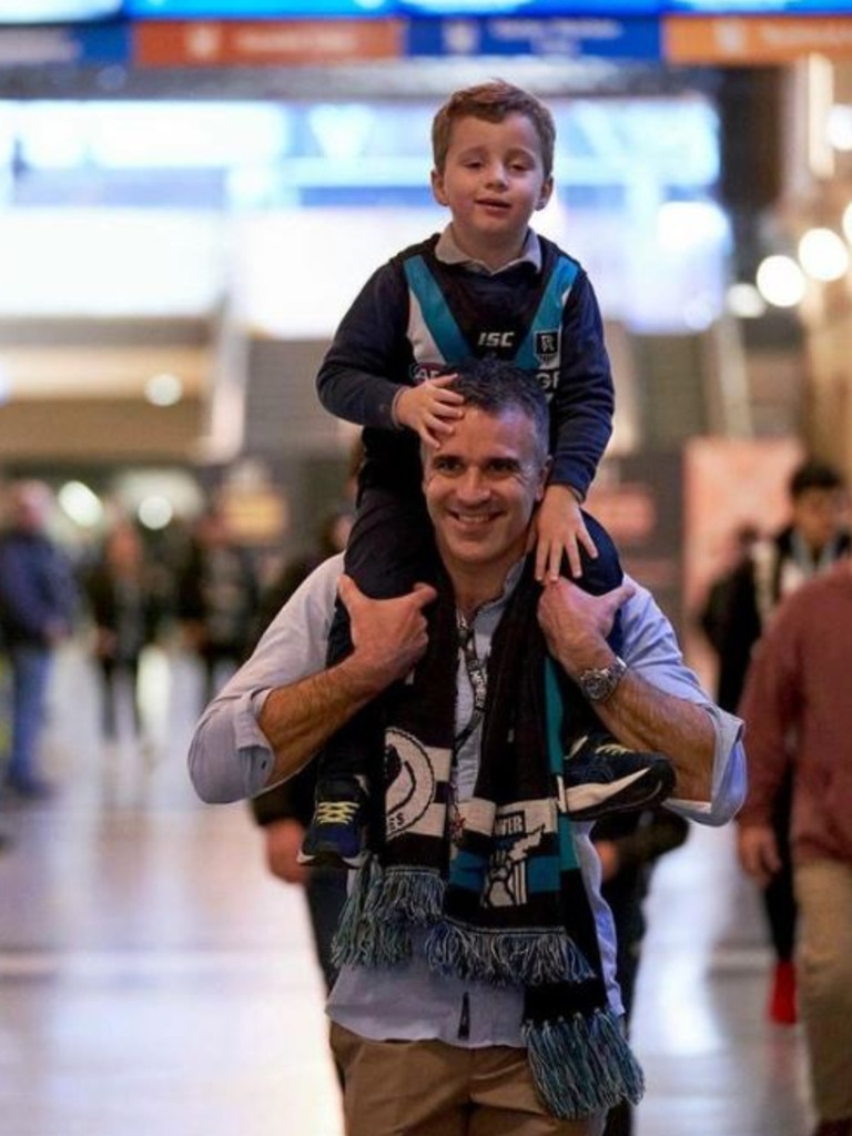 Mr Malinauskas (pictured with son Jack) said being asked about sport during a press conference was ‘a dream come true’. Picture: Instagram