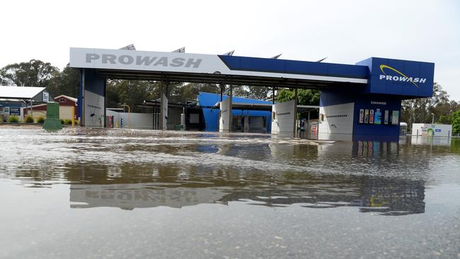 A car wash in Shepparton remains partly submerged as flood waters spread across northern Victoria. Picture: NCA NewsWire / Andrew Henshaw