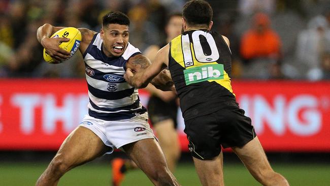 Tim Kelly takes on the tackle of Shane Edwards. Pic: AAP