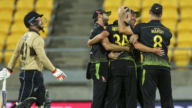 Australian players enjoy a wicket during their victory in the third T20 against New Zealand.