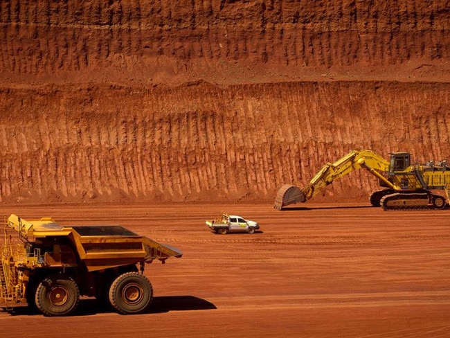 FILE PHOTO: Machinery operates in a pit at Rio Tinto Group's West Angelas iron ore mine in Pilbara, Australia, on Sunday, Feb. 19, 2012. Rio Tinto Group said Chief Executive Officer Tom Albanese will step down, after announcing a surprise $14 billion impairment. Sam Walsh, head of the iron-ore division, has been appointed as his successor with effect from today, the company said in a statement. Photographer: Ian Waldie/Bloomberg via Getty Images