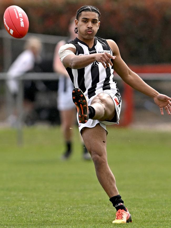 Reuben Rode gets a kick for Wallan. Picture: Andy Brownbill