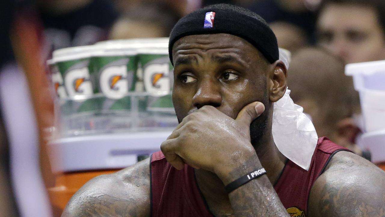 Miami Heat forward LeBron James watches action against the San Antonio Spurs during the second half in Game 1 of the NBA basketball finals on Thursday, June 5, 2014 in San Antonio. (AP Photo/Eric Gay)