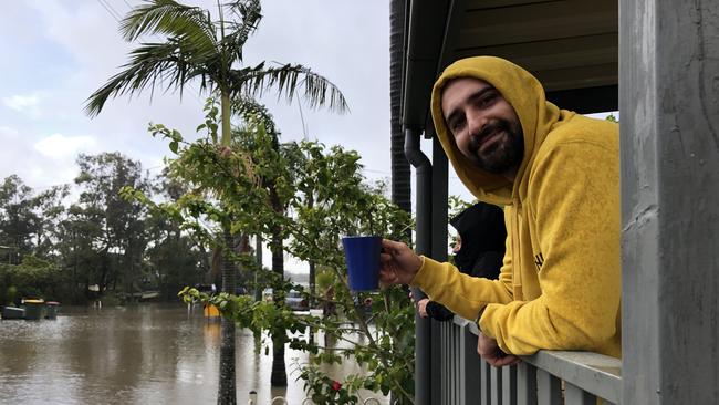 Cheyne Jones waded through the floodwaters to check on colleague Caterina Fahey.