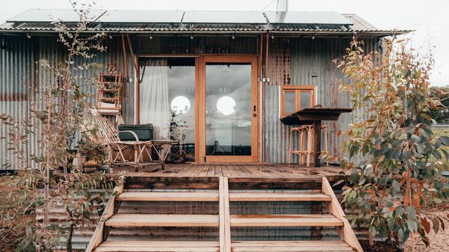 The tiny house’s deck makes the perfect spot for a sunset dinner.