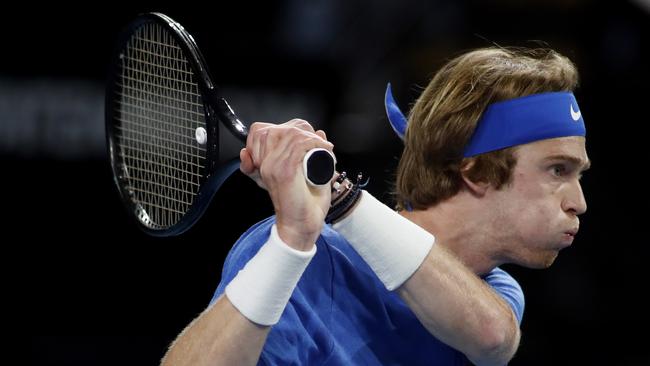 Andrey Rublev plays a shot against Felix Auger-Aliassime. Picture: AAP Image/Kelly Barnes