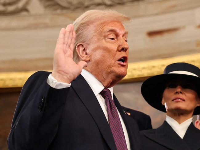 U.S. President-elect Donald Trump takes the oath of office as Melania Trump, Ivanka Trump, Donald Trump Jr. and Eric Trump look on during inauguration ceremonies in the Rotunda of the U.S. Capitol on January 20, 2025 in Washington, DC. Donald Trump takes office for his second term as the 47th president of the United States. (Photo by Chip Somodevilla / AFP)