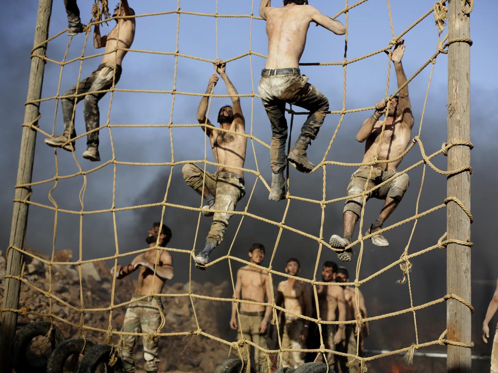 Turkish-backed forces from the Free Syrian Army exercise during military training near Azaz, in north Syria. Picture: AP