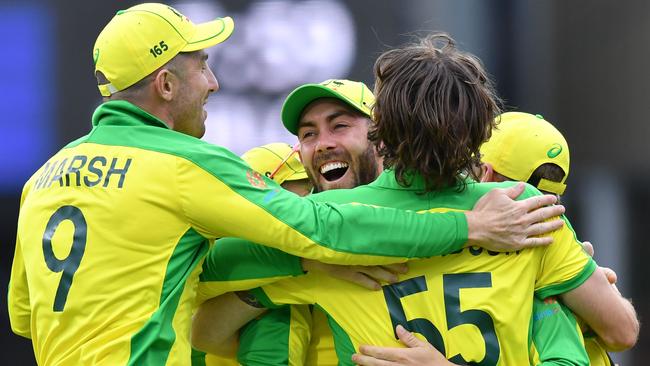 Australia's Glenn Maxwell, centre, is embraced by teammates after running out Pakistan's captain Sarfaraz Ahmed for victory in their World Cup game. Picture: AFP