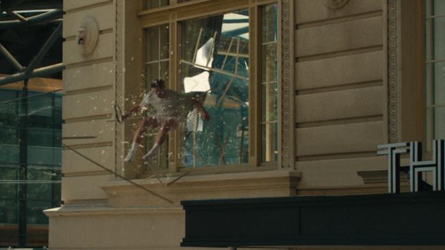 Glass act … Andy Murray makes a dramatic escape by jumping through the first floor window at Melbourne’s Savoy Hotel. Picture: Supplied