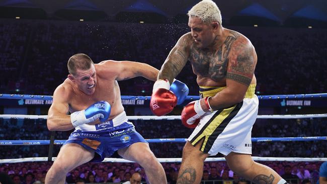 Paul Gallen and Mark Hunt went hammer and tongs in an incredible fight in Sydney. Picture: Getty Images