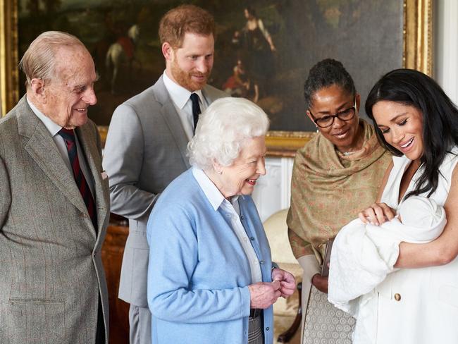 The Queen with Prince Philip meeting Archie before Prince Harry and Meghan Markle moved to the US. Picture: Getty Images