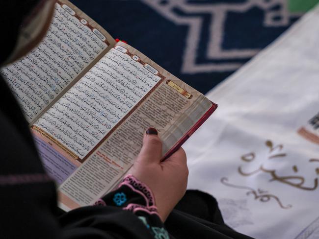 SELANGOR, MALAYSIA - MARCH 22: A Muslim woman reads the Quran at Sultan Salahuddin Abdul Aziz Mosque during the holy month of Ramadan on March 22, 2024, in Shah Alam, Selangor, Malaysia. During Ramadan, the ninth month of the Islamic calendar, Muslims worldwide observe a period of fasting, prayer, reflection, and community engagement, abstaining from food, drink, and other physical needs from dawn to dusk, while the Malaysian Ramadan experience is marked by vibrant cultural and religious traditions, including communal prayers, family iftar gatherings, and shared meals, fostering spiritual growth, self-discipline, and communal solidarity. (Photo by Annice Lyn/Getty Images)