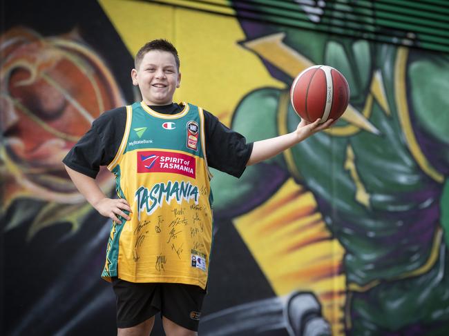 JackJumpers jersey winner Brady "Boomer" Bluett at the JackJumpers mural, MyState Bank Arena. Picture: Chris Kidd