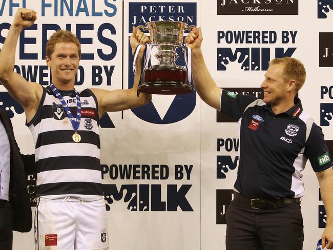 Port Melbourne vs Geelong at Etihad Stadium. Troy Selwood and Matthew Knights hold the cup aloft