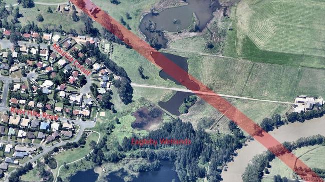 The red line shows where the gazetted road will cross through Eagleby Wetlands.