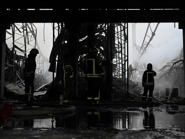 Ukrainian rescuers work at the site of a drone strike at a warehouse building in the Boryspil district of Kyiv region. Picture: AFP