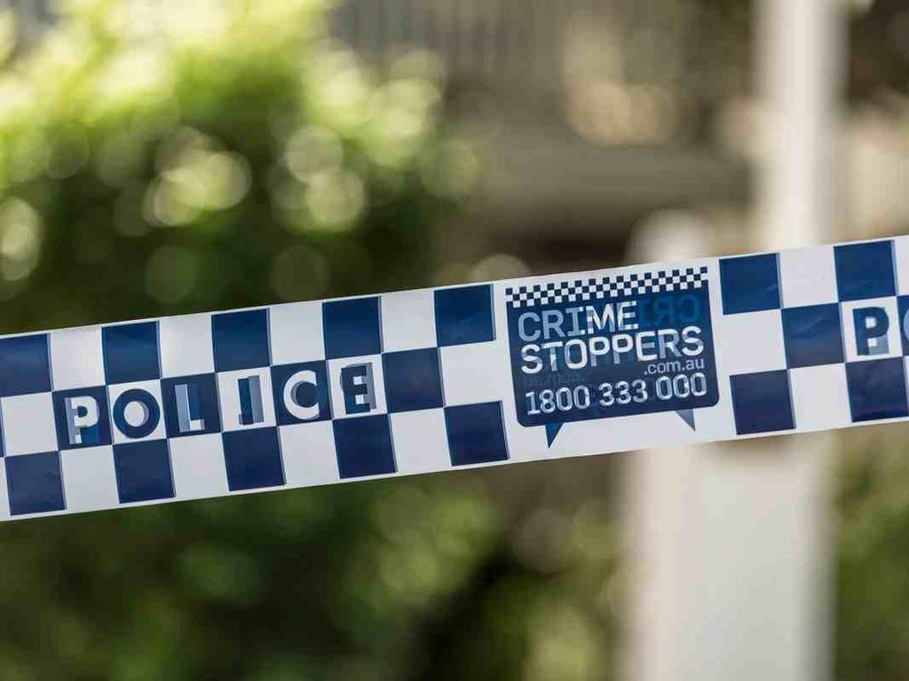 Police attend the site of a crash after reports of an abandoned rolled vehicle Credit: QPS