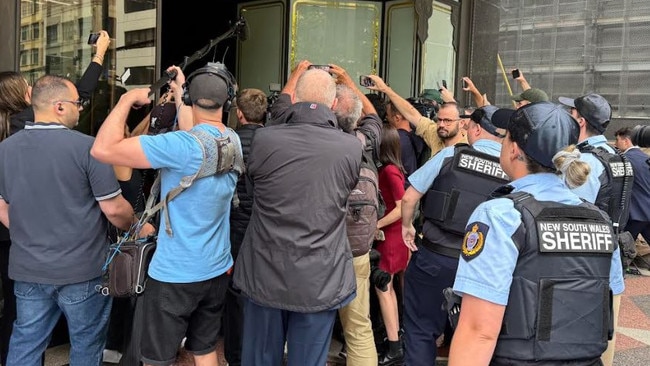 Jones and his legal team were heckled outside court.