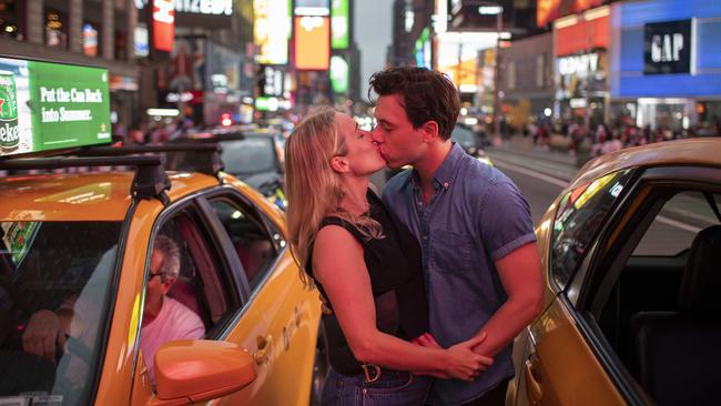 Phillip Mach, 31, and Elizabeth Roman, 33, both who live in the East Village, in Times Square in Manhattan, New York City on July 13. Picture: Andrew Kelly