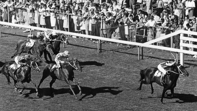 Bob Cox rides Wisecourt to victory at a packed Oakbank Racecourse in 1967.