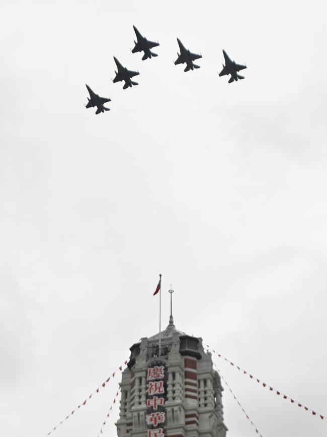 F-16 jets fly over the Presidential Office during Taiwan's National Day in Taipei on Saturday,. Picture: AFP