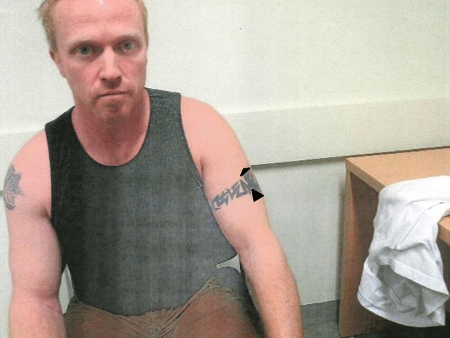 Exhibits from the rape trial of Adrian Bayley, who killed Jill Meagher. Photos depict the tattoo on the arm of Adrian Bayley.