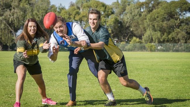 Andrew Balkwill, pictured in 2015 at Thomas More College where he used to be principal, wearing the light blue “M&amp;Ms” guernsey he donned for the club in his only game in 1997. Picture: Thomas More College.