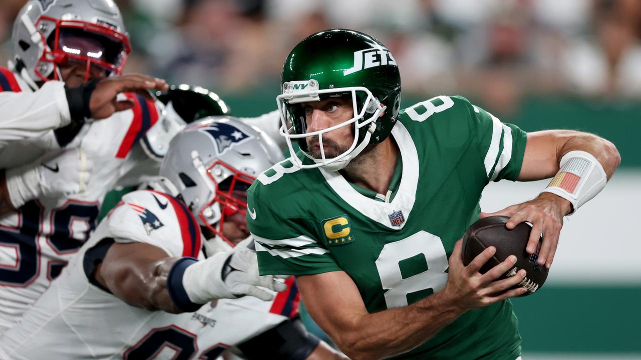 Aaron Rodgers of the New York Jets scrambles against the New England Patriots in Week 3. Picture: Al Bello/Getty Images