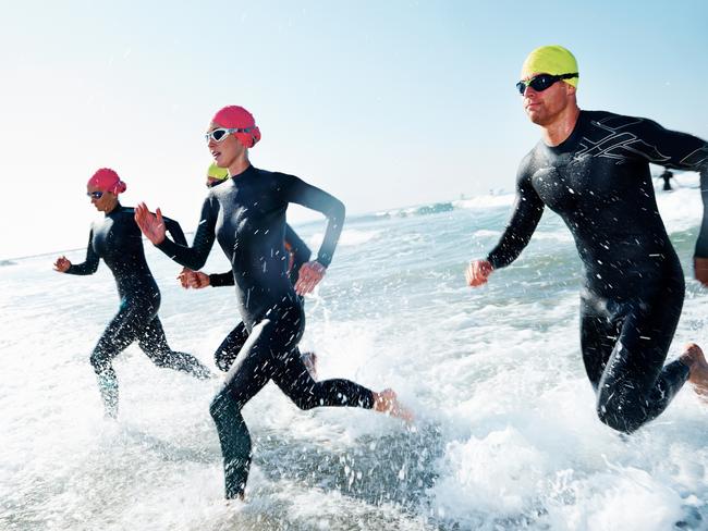 A group of athletes competing in a triathlon