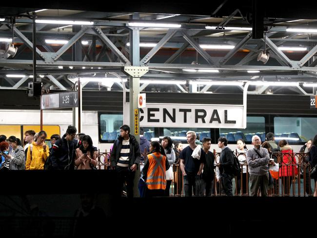 Passengers wait at Central stations for trains that were majorly delayed due to work on the overhead lines last night, Central station, Sydney, 18th August 2018. Photo by Damian Shaw