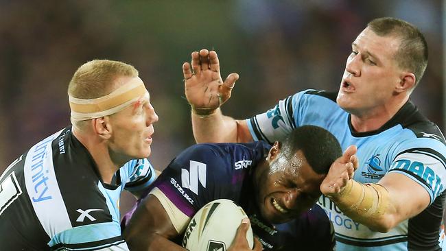 Suliasi Vunivalu of the Storm tackled by Luke Lewis and Paul Gallen during the Cronulla Sharks v Melbourne Storm NRL Grand Final at ANZ Stadium, Sydney Olympic Park, pic Mark Evans