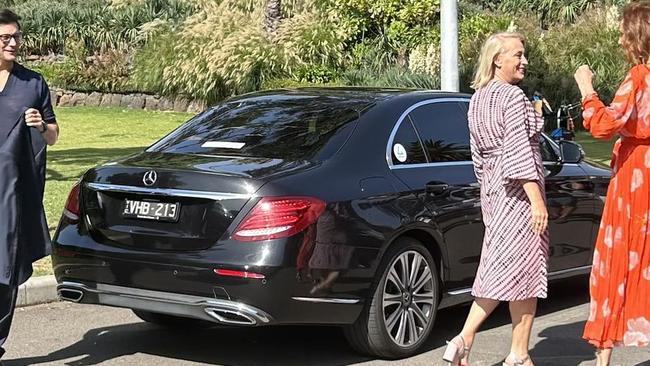 Lord Mayor Sally Capp (centre) arrives by limo on February 15 for the 2023 Moomba Monarch announcement, with Rob Mills and Rhonda Burchmore.