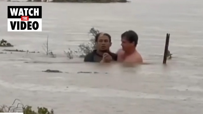 Incredible moment drowning man is rescued from Grantham floodwaters (7 News)