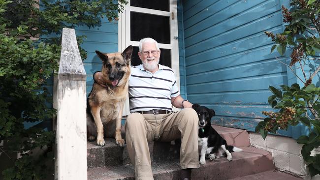 Maydena resident Trevor Ethell with his dogs Ava the German Shepherd and Henry the Jack Russell x. Picture: LUKE BOWDEN