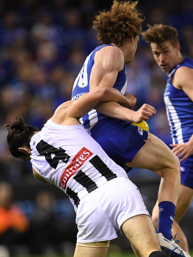 Brodie Grundy tackles Ben Brown.