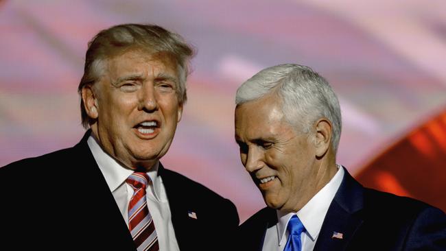 Donald Trump congratulates his running mate Indiana Governor Mike Pence after Pence formally accepted the nomination during the third day of the Republican National Convention in 2016.