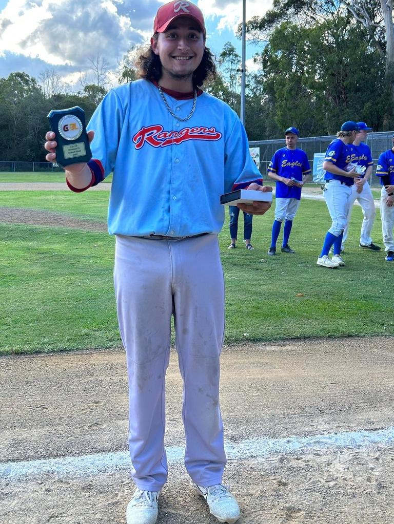 Toowoomba Rangers pitcher Cody Luchterhand celebrates with his MVP trophy after defeating Mt Gravatt in the Div 4 GBL Grand Final.