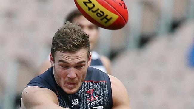 Luke Tapscott takes a kick for Melbourne in the AFL. He’s lining up for the Chelsea Heights Demons this year.