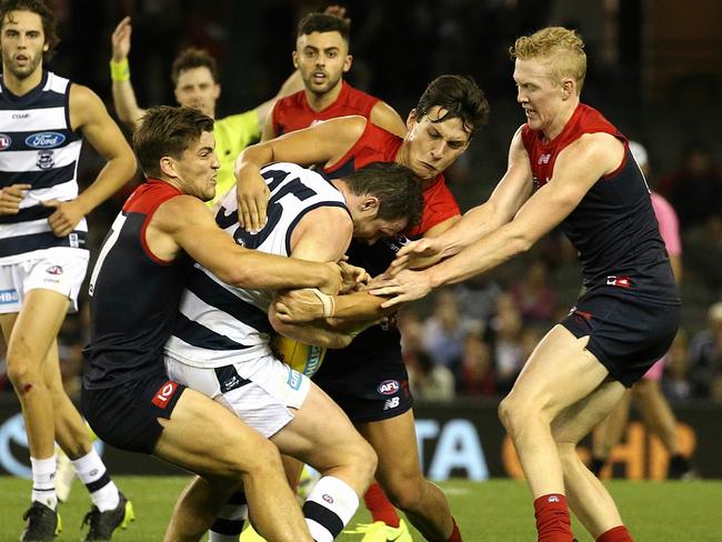 AFL Geelong Cats vs. Melbourne (ES) Jack Viney Sam Weideman & Clayton Oliver tackle Patrick Dangerfield  (T) Picture:Wayne Ludbey